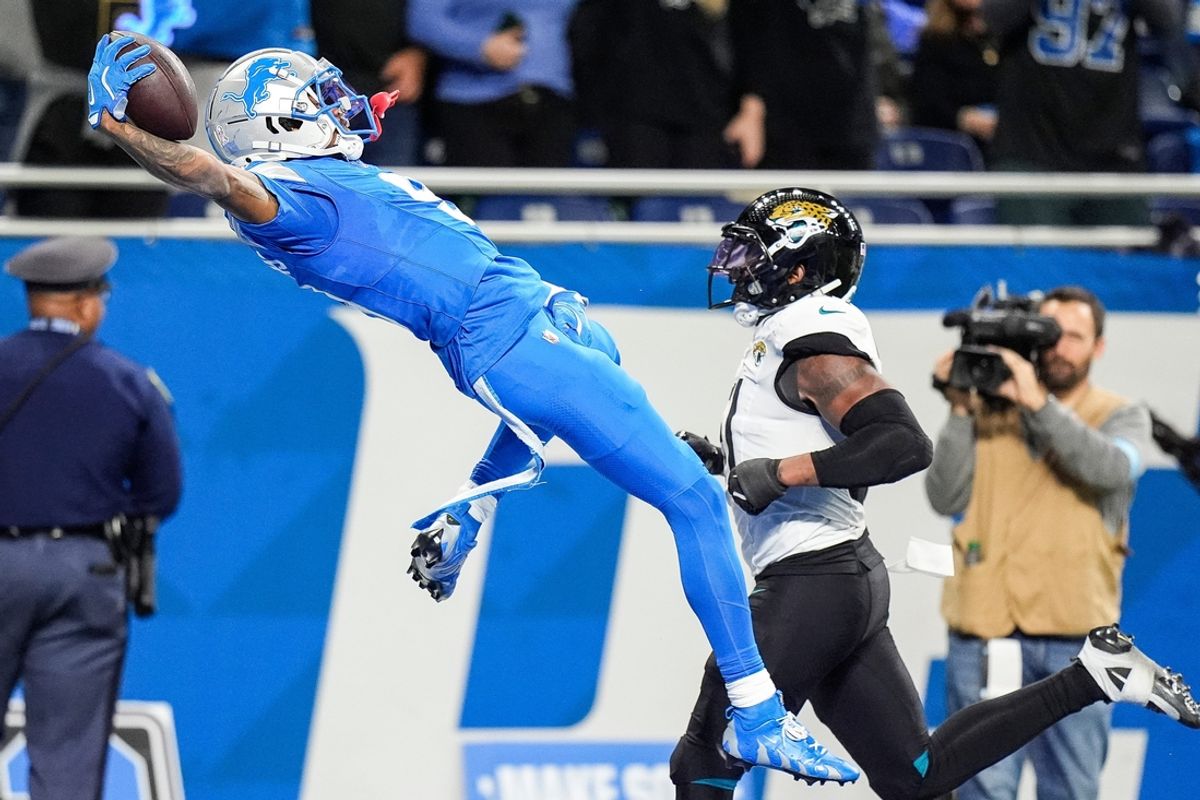Detroit Lions wide receiver Jameson Williams dives into the end zone to celebrate scoring a touchdown against the Jacksonville Jaguars during the second half at Ford Field in Detroit on Sunday, Nov. 17, 2024.