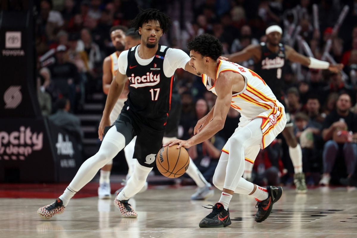 Nov 17, 2024; Portland, Oregon, USA; Portland Trail Blazers guard Shaedon Sharpe (17) defends Atlanta Hawks forward Zaccharie Risacher (10)  in the first half at Moda Center. Mandatory Credit: Jaime Valdez-Imagn Images