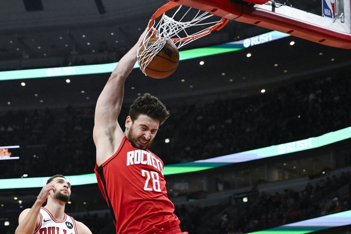 Nov 17, 2024; Chicago, Illinois, USA;  Houston Rockets center Alperen Sengun (28) dunks the ball against the Chicago Bulls during the first half at United Center. Mandatory Credit: Matt Marton-Imagn Images