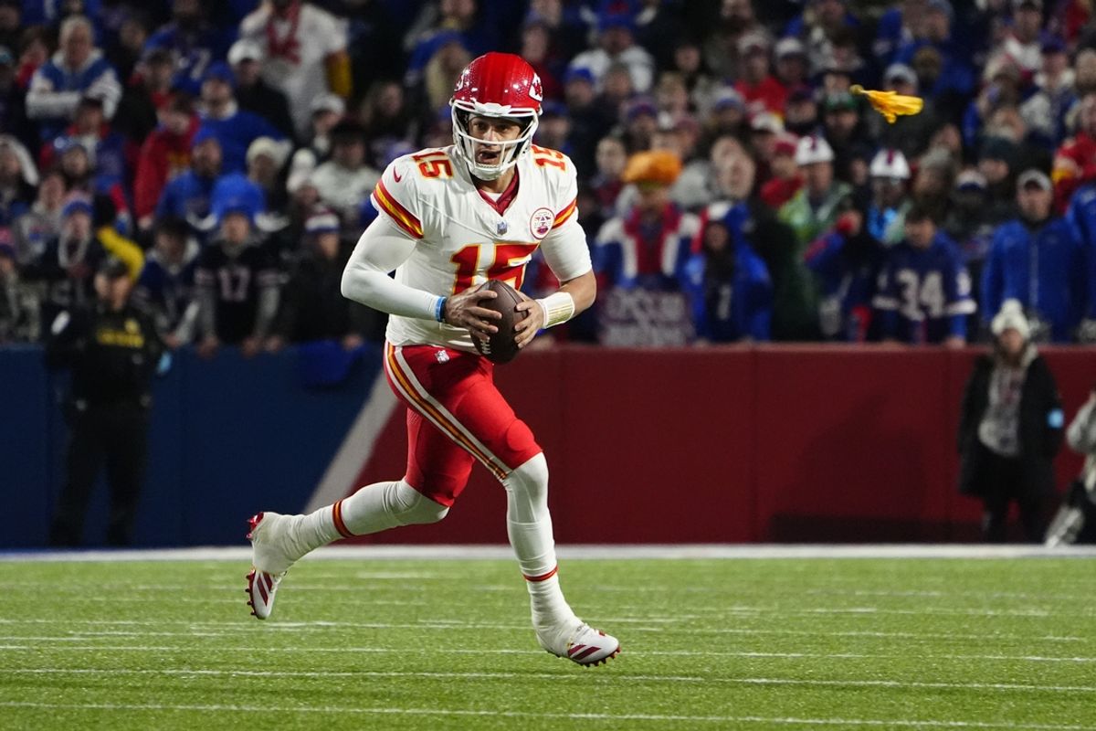 Nov 17, 2024; Orchard Park, New York, USA; Kansas City Chiefs quarterback Patrick Mahomes (15) rolls out looking to throw the ball against the Buffalo Bills during the second half at Highmark Stadium. Mandatory Credit: Gregory Fisher-Imagn Images