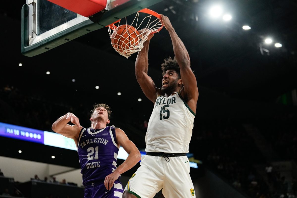 Nov 17, 2024; Waco, Texas, USA;  Baylor Bears forward Norchad Omier (15) dunks the ball against Tarleton Texans guard Nick Krass (21) during the first half at Paul and Alejandra Foster Pavilion. Mandatory Credit: Chris Jones-Imagn Images