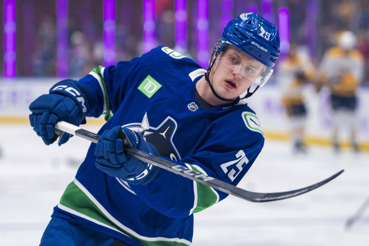 Nov 17, 2024; Vancouver, British Columbia, CAN; Vancouver Canucks defenseman Elias Pettersson (25) shoots during warm up prior to a game against the Nashville Predators at Rogers Arena. Mandatory Credit: Bob Frid-Imagn Images