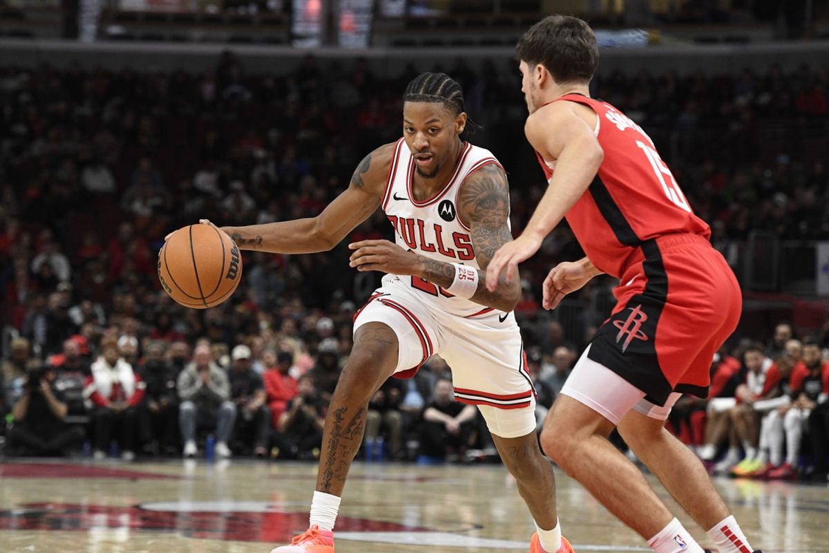 Nov 17, 2024; Chicago, Illinois, USA;  Chicago Bulls forward Dalen Terry (25) drives the ball against Houston Rockets guard Reed Sheppard (15) during the second half at United Center. Mandatory Credit: Matt Marton-Imagn Images