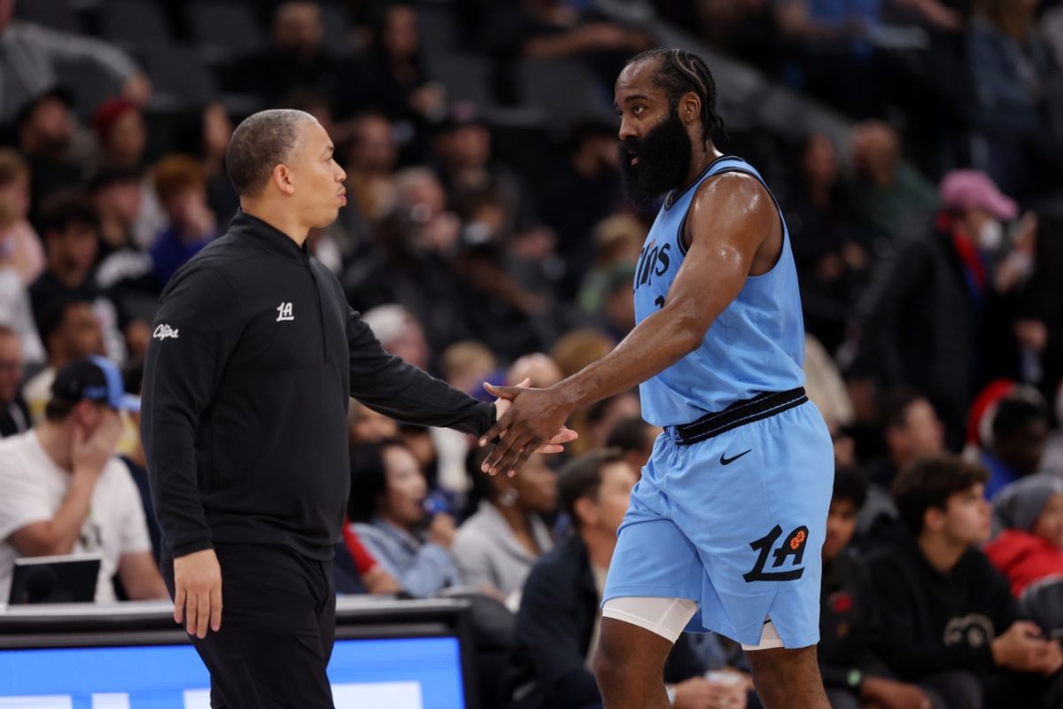 Nov 17, 2024; Inglewood, California, USA;  Los Angeles Clippers guard James Harden (1) is greeted by head coach Tyronn Lue during the first quarter against the Utah Jazz at Intuit Dome. Mandatory Credit: Kiyoshi Mio-Imagn Images