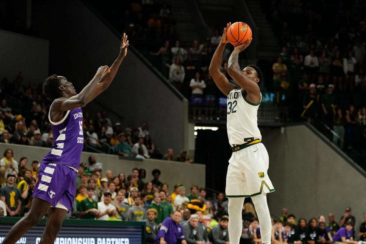 Nov 17, 2024; Waco, Texas, USA;  Baylor Bears guard Jalen Celestine (32) scores a three-point basket against Tarleton Texans forward Chris Mpaka (23) during the second half at Paul and Alejandra Foster Pavilion. Mandatory Credit: Chris Jones-Imagn Images