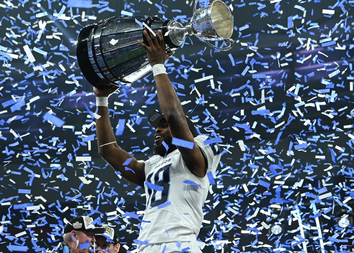 Nov 17, 2024; Vancouver, British Columbia, CAN; Toronto Argonauts wide receiver Dejon Brissett (18) holds up the Grey Cup at BC Place against Winnipeg Blue Bombers . Mandatory Credit: Simon Fearn-Imagn Images