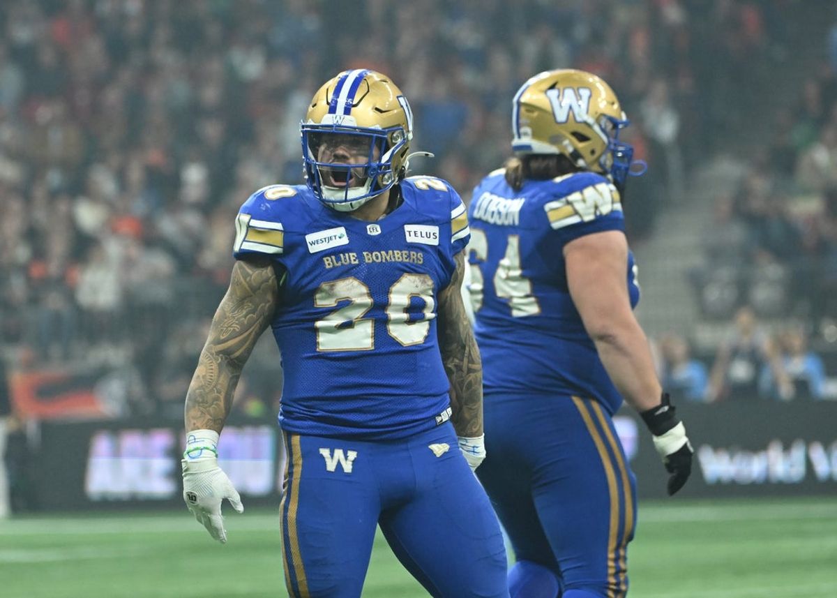 Nov 17, 2024; Vancouver, British Columbia, CAN; Winnipeg Blue Bombers running back Brady Oliveira (20) celebrates a play at BC Place against Toronto Argonauts during the third quarter. Mandatory Credit: Simon Fearn-Imagn Images