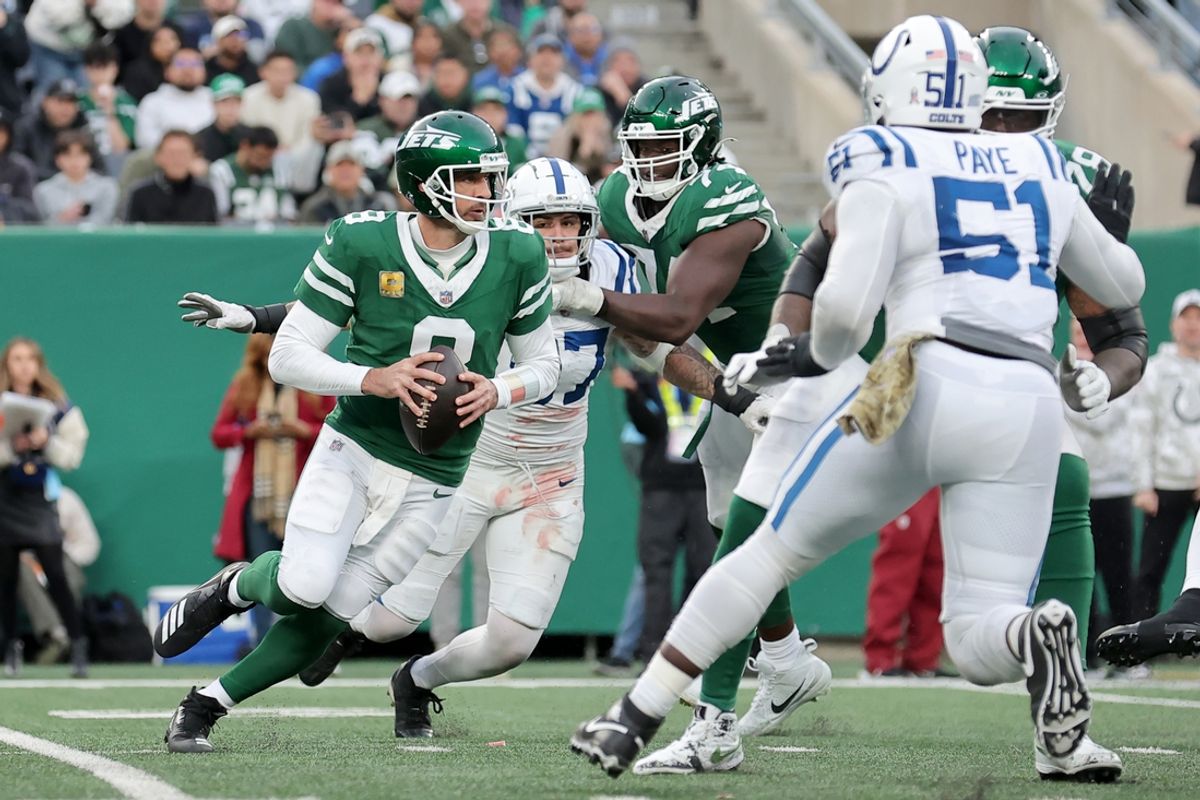 Nov 17, 2024; East Rutherford, New Jersey, USA; New York Jets quarterback Aaron Rodgers (8) looks to pass against the Indianapolis Colts during the fourth quarter at MetLife Stadium. Mandatory Credit: Brad Penner-Imagn Images
