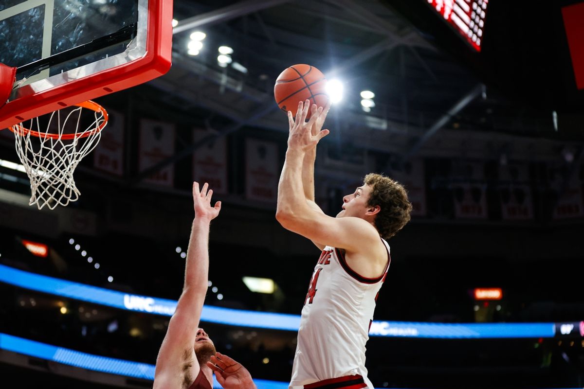 Nov 18, 2024; Raleigh, North Carolina, USA;  North Carolina State Wolfpack forward Ben Middlebrooks (34) dunks ball during first half of the game against the Colgate Raiders at Lenovo Center. Mandatory Credit: Jaylynn Nash-Imagn Images