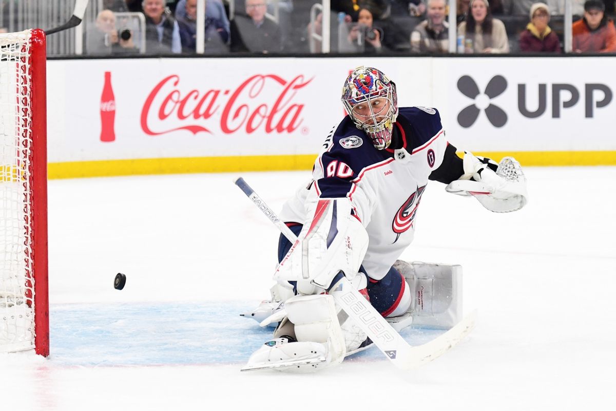 Nov 18, 2024; Boston, Massachusetts, USA;  Columbus Blue Jackets goaltender Elvis Merzlikins (90) makes a save during the first period against the Boston Bruins at TD Garden. Mandatory Credit: Bob DeChiara-Imagn Images