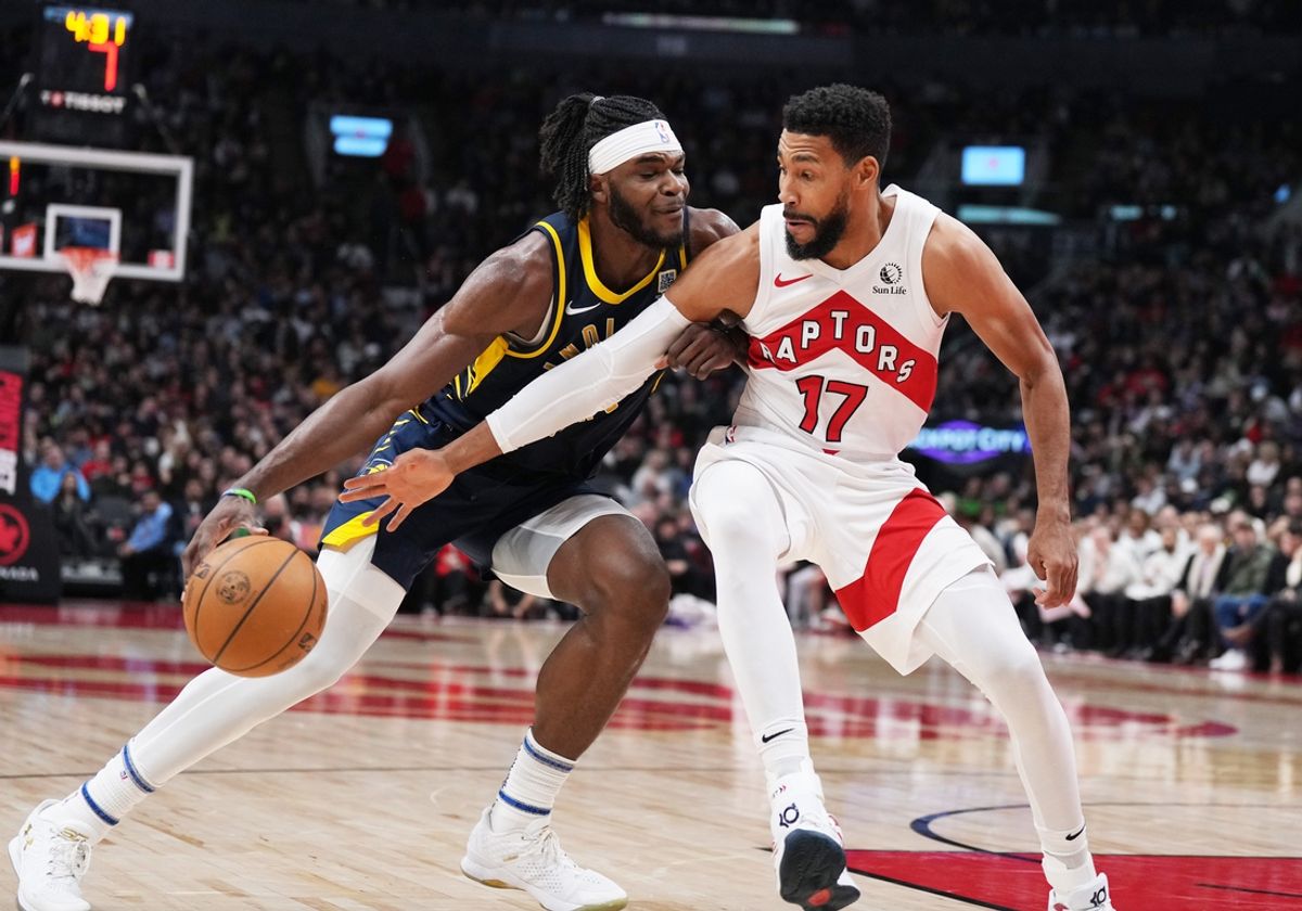 Nov 18, 2024; Toronto, Ontario, CAN; Indiana Pacers forward Jarace Walker (5) and Toronto Raptors forward Garrett Temple (17) battle for the ball during the second quarter at Scotiabank Arena. Mandatory Credit: Nick Turchiaro-Imagn Images