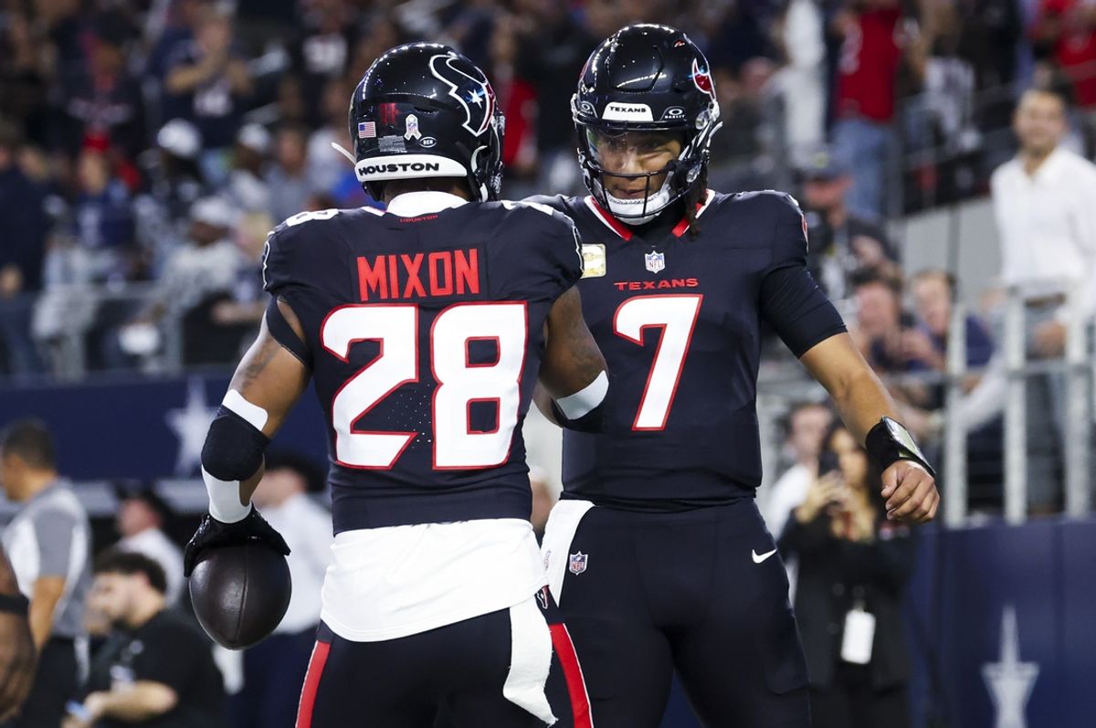 Nov 18, 2024; Arlington, Texas, USA;  Houston Texans running back Joe Mixon (28) celebrates with Houston Texans quarterback C.J. Stroud (7) after scoring a touchdown  during the first quarter against the Dallas Cowboys at AT&T Stadium. Mandatory Credit: Kevin Jairaj-Imagn Images