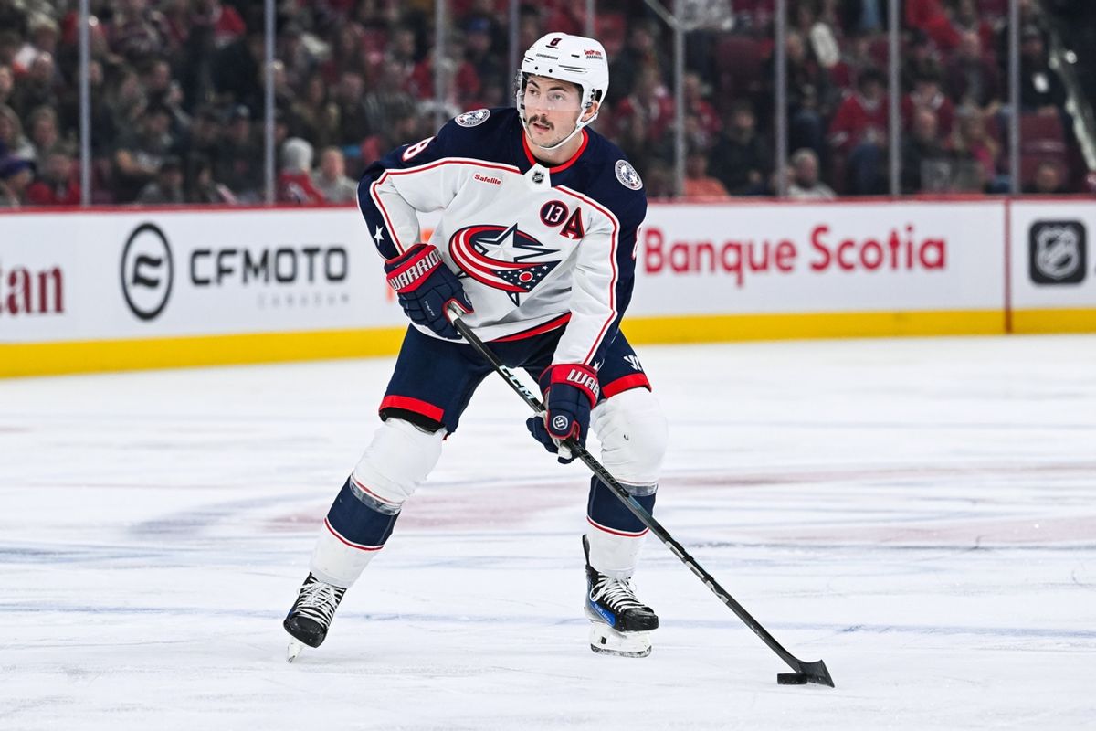 Nov 16, 2024; Montreal, Quebec, CAN; Columbus Blue Jackets defenseman Zach Werenski (8) plays the puck against the Montreal Canadiens during the first period at Bell Centre. Mandatory Credit: David Kirouac-Imagn Images