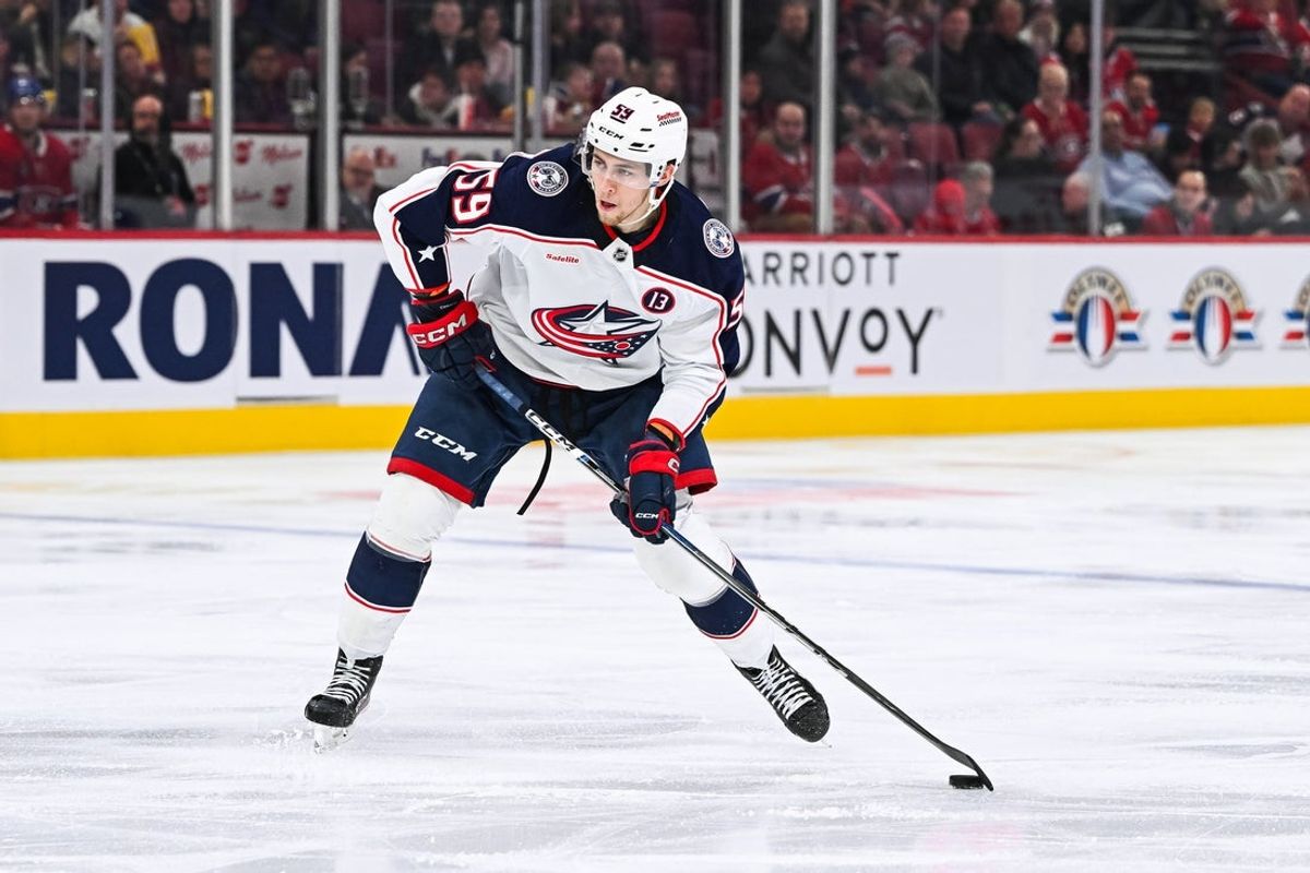 Nov 16, 2024; Montreal, Quebec, CAN;Columbus Blue Jackets right wing Yegor Chinakhov (59) plays the puck against the Montreal Canadiens  during the third period at Bell Centre. Mandatory Credit: David Kirouac-Imagn Images