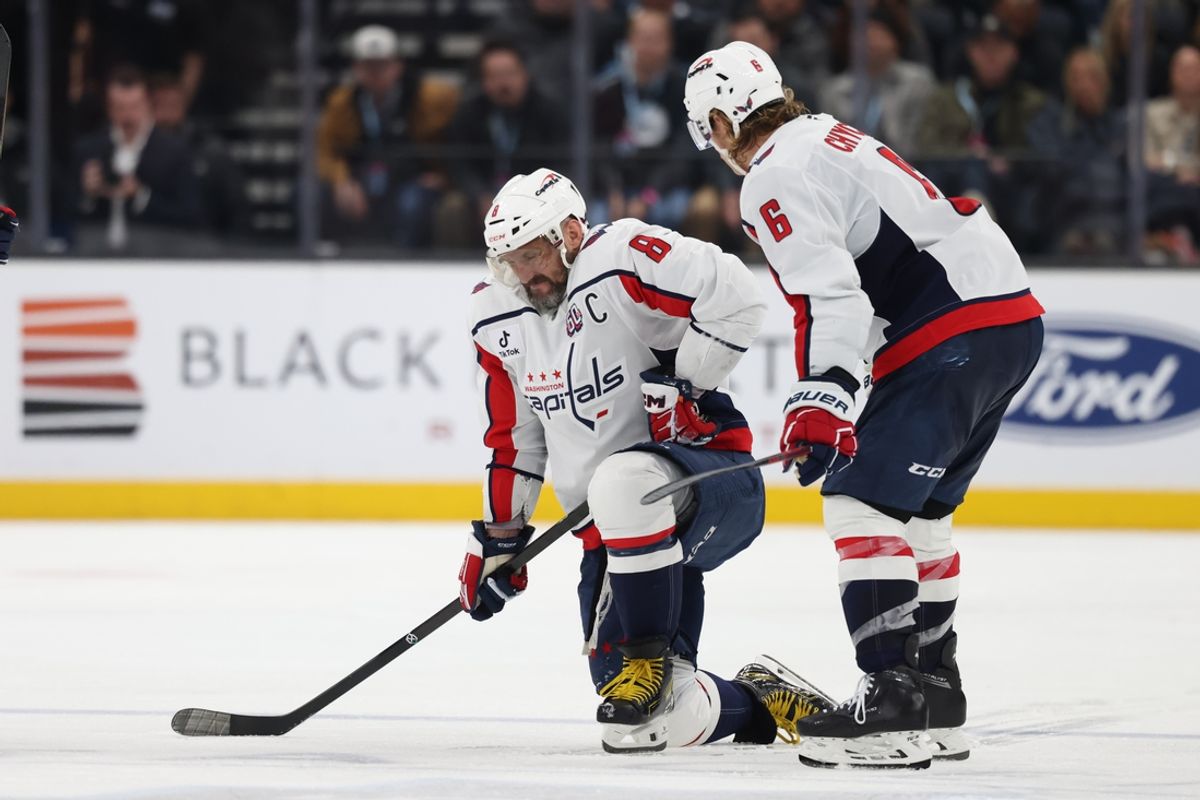 Nov 18, 2024; Salt Lake City, Utah, USA; Washington Capitals left wing Alex Ovechkin (8) is injured on a play against the Utah Hockey Club during the third period at Delta Center. Mandatory Credit: Rob Gray-Imagn Images