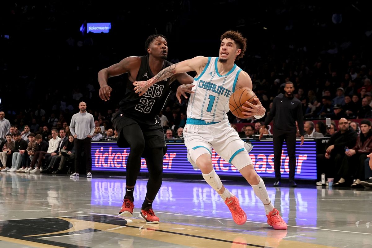 Nov 19, 2024; Brooklyn, New York, USA; Charlotte Hornets guard LaMelo Ball (1) drives to the basket against Brooklyn Nets forward Dorian Finney-Smith (28) during the first quarter at Barclays Center. Mandatory Credit: Brad Penner-Imagn Images