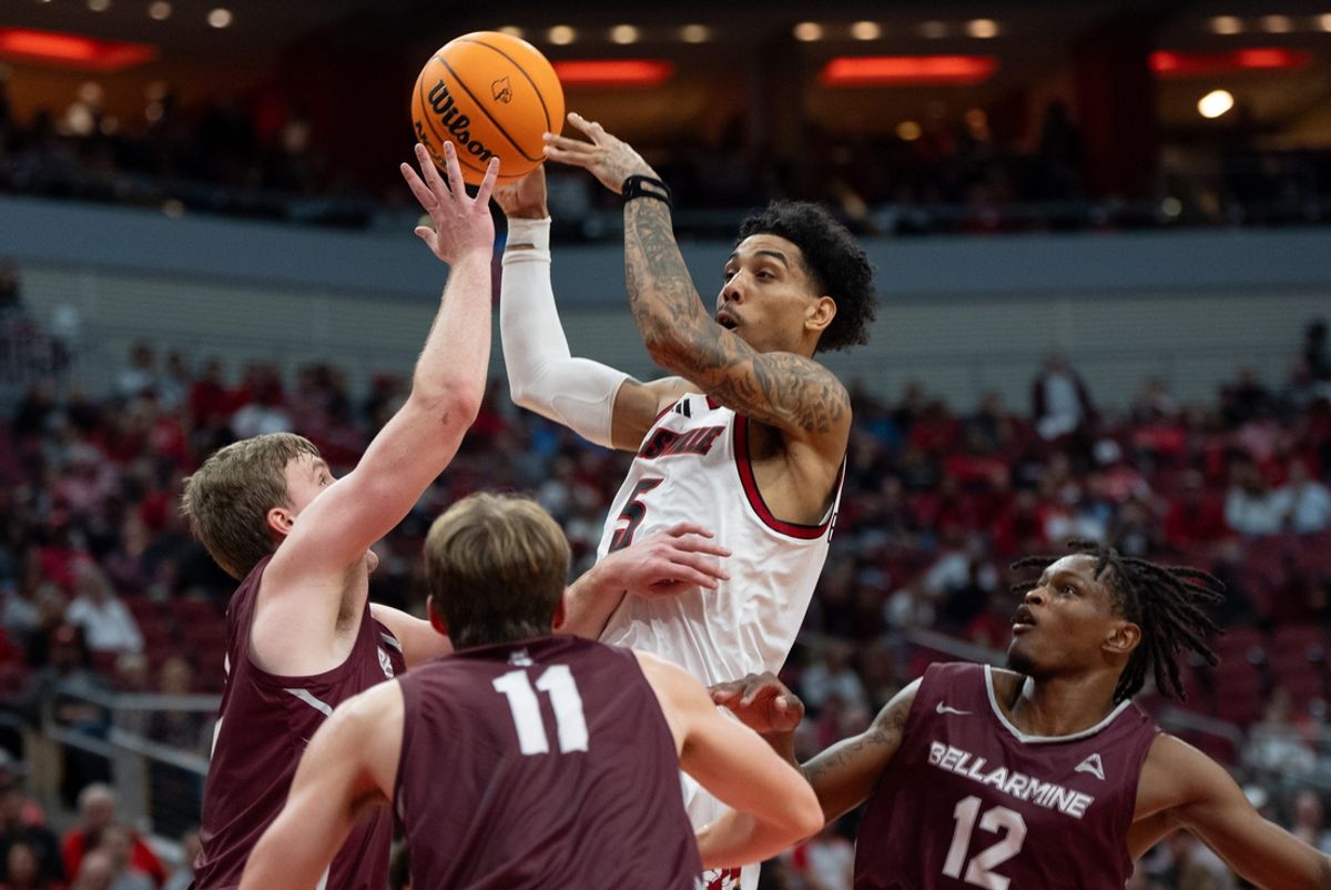 Louisville Cardinals guard Terrence Edwards Jr. (5) attempts a jump shot against Bellarmine Knights defenders during their game on Tuesday, Nov. 19, 2024 at the KFC Yum! Center in Louisville, Ky.