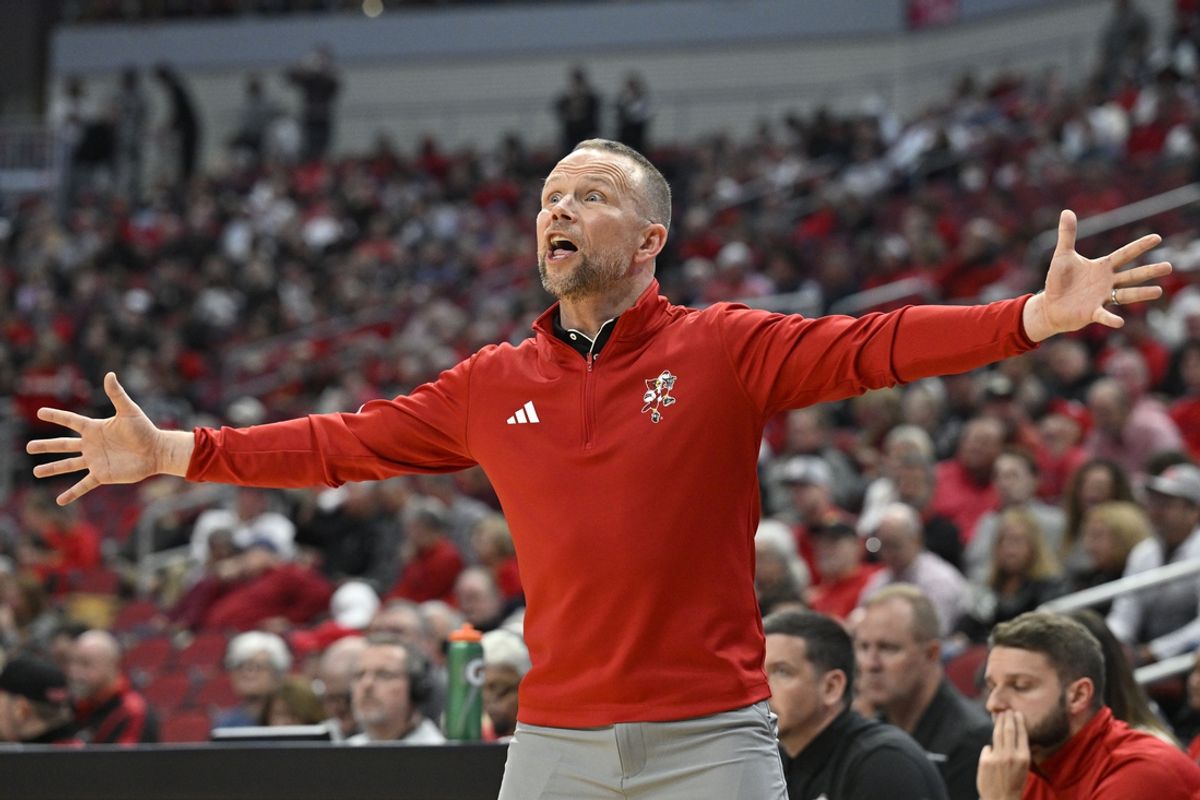 Nov 19, 2024; Louisville, Kentucky, USA;  Louisville Cardinals head coach Pat Kelsey reacts during the first half against the Bellarmine Knights at KFC Yum! Center. Mandatory Credit: Jamie Rhodes-Imagn Images