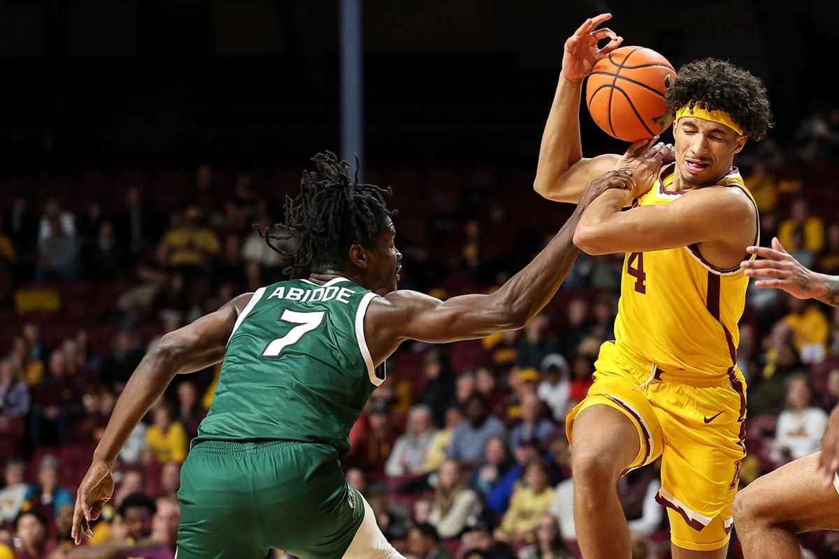 Nov 19, 2024; Minneapolis, Minnesota, USA; Minnesota Golden Gophers forward Kadyn Betts (4) drives towards the basket as Cleveland State Vikings forward Isaac Abidde (7) defends during the first half at Williams Arena. Mandatory Credit: Matt Krohn-Imagn Images