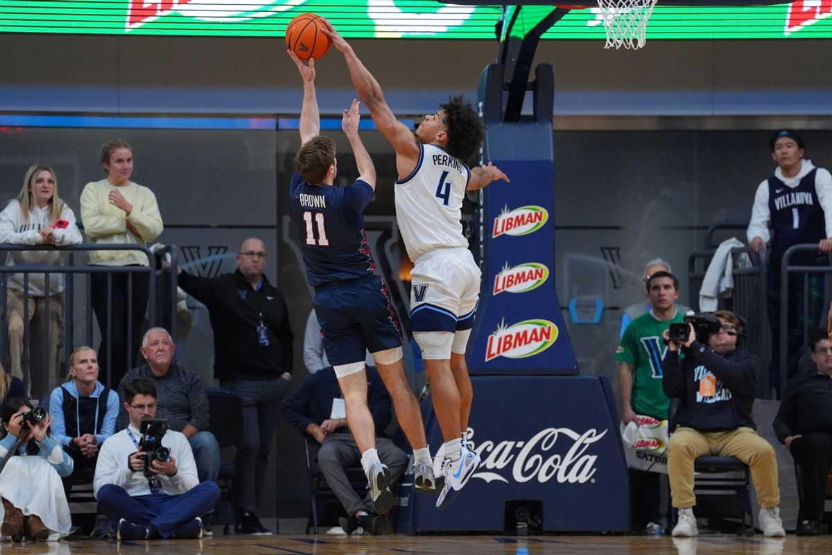 Nov 19, 2024; Villanova, Pennsylvania, USA; Villanova Wildcats guard Tyler Perkins (4) blocks a shot from Penn Quakers guard Sam Brown (11) in the first half at William B. Finneran Pavilion. Mandatory Credit: Kyle Ross-Imagn Images