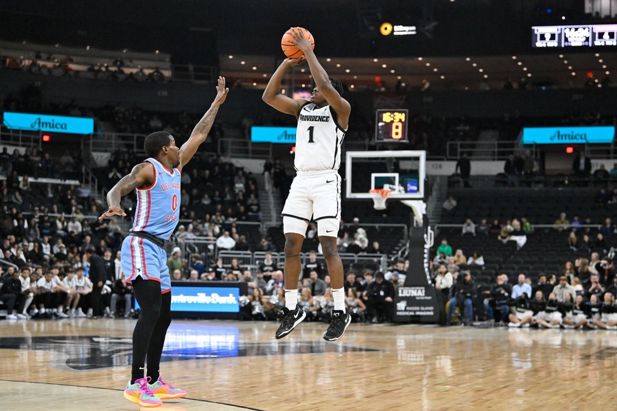 Nov 19, 2024; Providence, Rhode Island, USA; Providence Friars guard Jayden Pierre (1) shoots the ball over Delaware State Hornets guard Robert Smith (0) during the first half at Amica Mutual Pavilion. Mandatory Credit: Eric Canha-Imagn Images