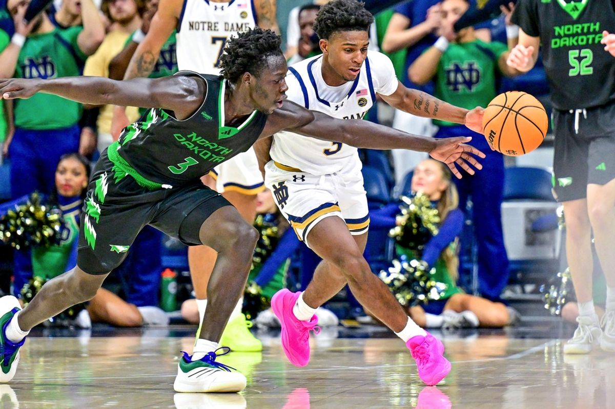 Nov 19, 2024; South Bend, Indiana, USA; Notre Dame Fighting Irish guard Markus Burton (3) knocks the ball away from North Dakota Fighting Hawks guard Mier Panoam (3) in the second half at the Purcell Pavilion. Mandatory Credit: Matt Cashore-Imagn Images
