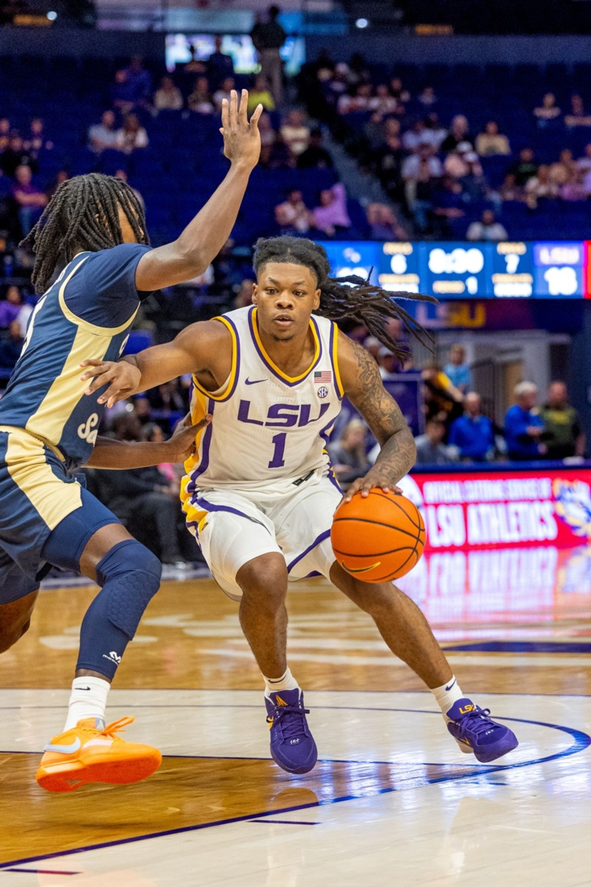 Nov 19, 2024; Baton Rouge, Louisiana, USA;  LSU Tigers guard Jordan Sears (1) dribbles against the Charleston Southern Buccaneers during the first half at Pete Maravich Assembly Center. Mandatory Credit: Stephen Lew-Imagn Images
