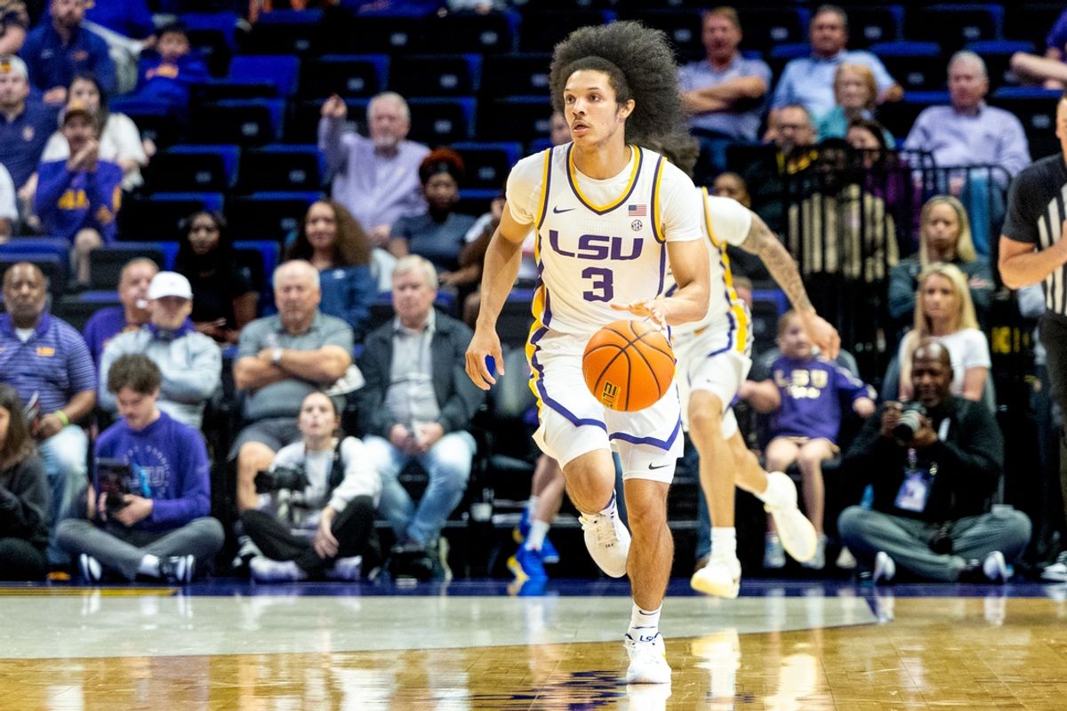 Nov 19, 2024; Baton Rouge, Louisiana, USA;  LSU Tigers guard Curtis Givens III (3) brings the ball up court against the Charleston Southern Buccaneers during the first half at Pete Maravich Assembly Center. Mandatory Credit: Stephen Lew-Imagn Images