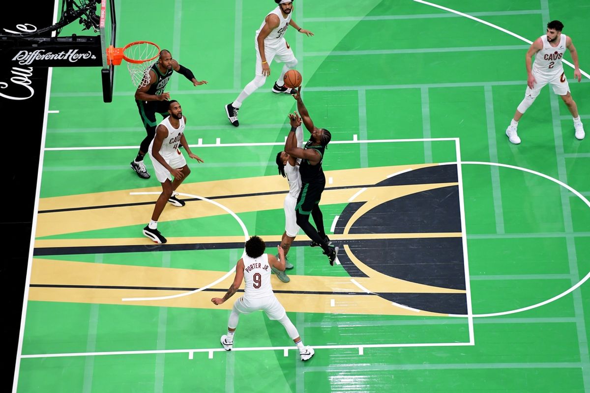 Nov 19, 2024; Boston, Massachusetts, USA;  Boston Celtics guard Jaylen Brown (7) shoots the ball while Cleveland Cavaliers guard Darius Garland (10) defends during the second half at TD Garden. Mandatory Credit: Bob DeChiara-Imagn Images