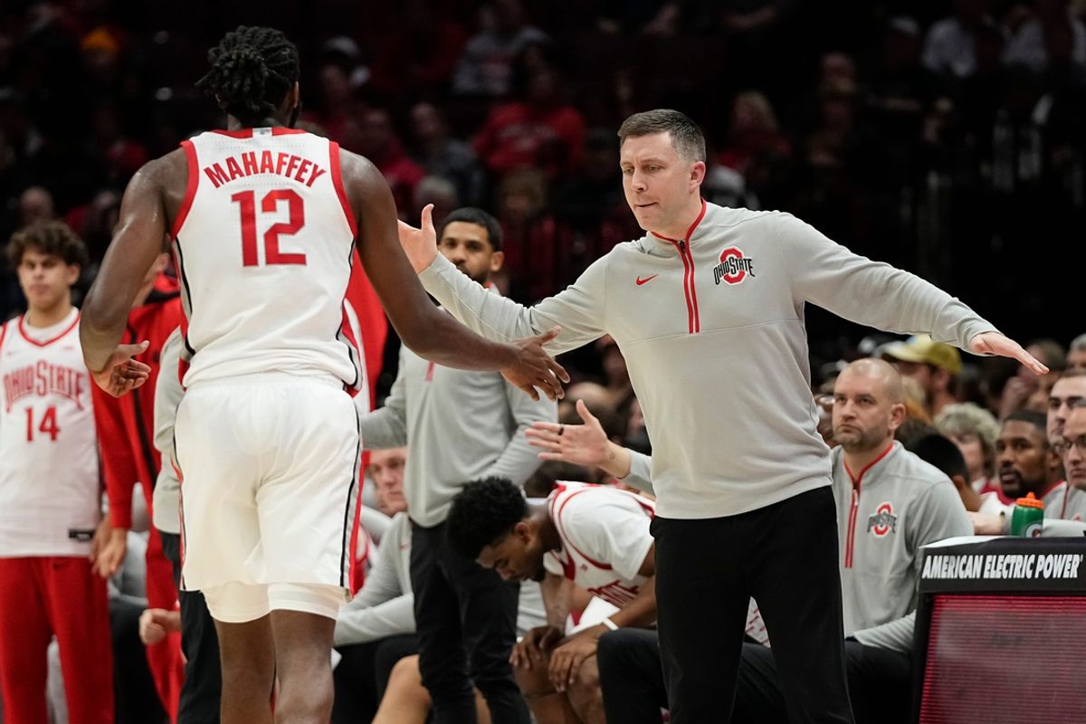 Ohio State Buckeyes head coach Jake Diebler high fives guard Evan Mahaffey (12) during the first half of the NCAA men's basketball game at Value City Arena in Columbus on Tuesday, Nov. 19, 2024.