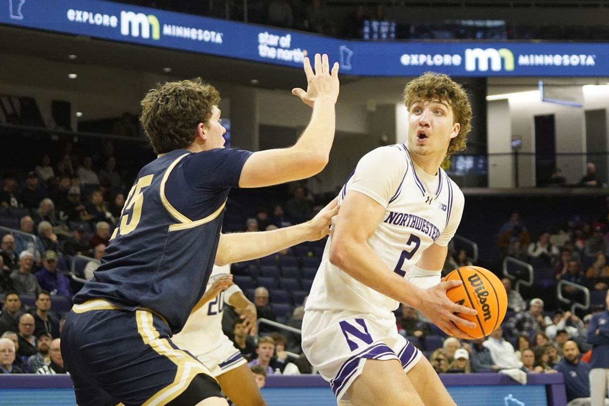 Nov 19, 2024; Evanston, Illinois, USA; Montana State Bobcats forward Sam Lecholat (25) defends Northwestern Wildcats forward Nick Martinelli (2) during the second half at Welsh-Ryan Arena. Mandatory Credit: David Banks-Imagn Images