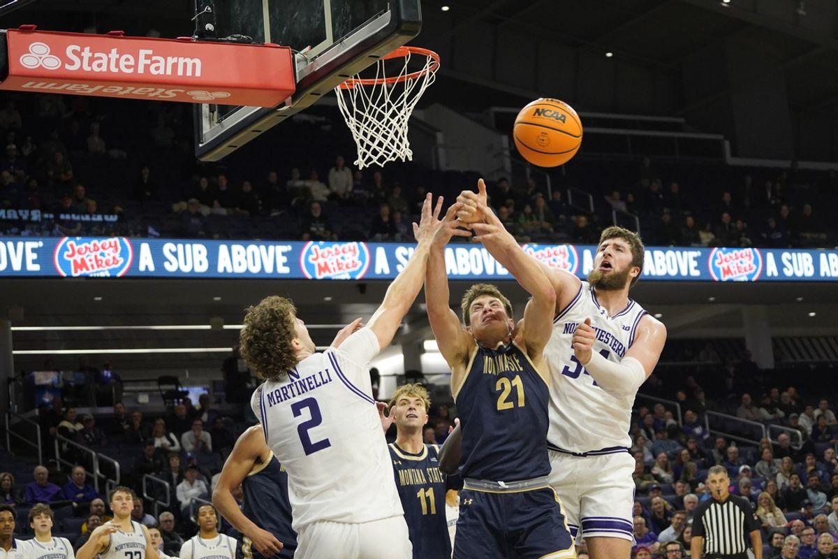Nov 19, 2024; Evanston, Illinois, USA; Northwestern Wildcats center Matthew Nicholson (34) forward Nick Martinelli (2) and Montana State Bobcats forward Brian Goracke (21) go for the ball during the second half at Welsh-Ryan Arena. Mandatory Credit: David Banks-Imagn Images