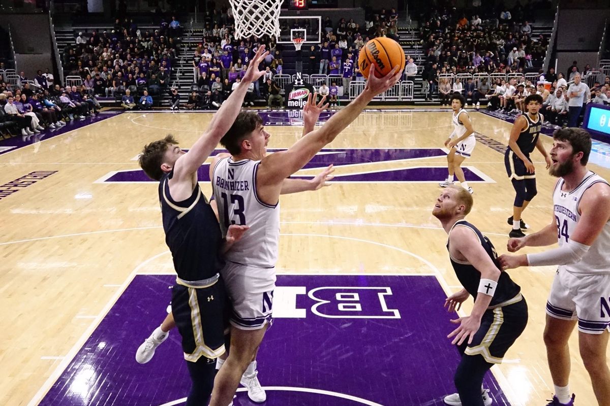 Nov 19, 2024; Evanston, Illinois, USA; Northwestern Wildcats guard Brooks Barnhizer (13) scores against the Montana State Bobcats during the first half at Welsh-Ryan Arena. Mandatory Credit: David Banks-Imagn Images