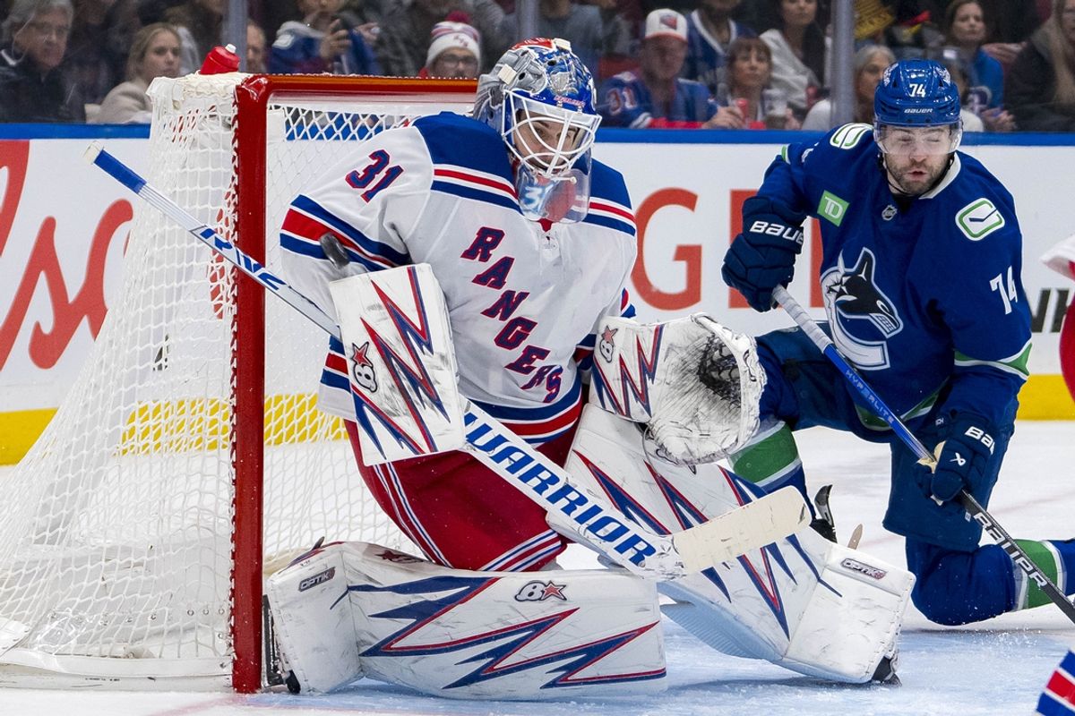 Nov 19, 2024; Vancouver, British Columbia, CAN; Vancouver Canucks forward Jake DeBrusk (74) watches as New York Rangers goalie Igor Shesterkin (31) makes a save during the second period at Rogers Arena. Mandatory Credit: Bob Frid-Imagn Images