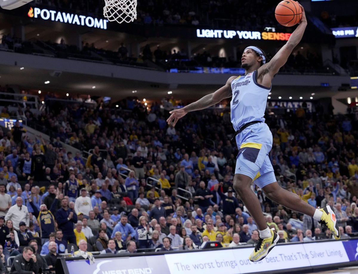 Marquette guard Chase Ross (2) throws down a dunk during the first half of their game against Purdue Tuesday, November 19, 2024 at Fiserv Forum in Milwaukee, Wisconsin.