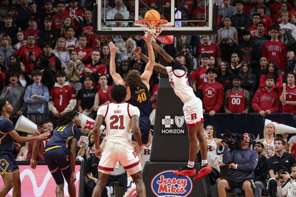 Nov 20, 2024; Piscataway, New Jersey, USA; Rutgers Scarlet Knights guard Jeremiah Williams (25) scores a basket during the first half against Merrimack Warriors forward Sean Trumper (40) at Jersey Mike's Arena. Mandatory Credit: Vincent Carchietta-Imagn Images