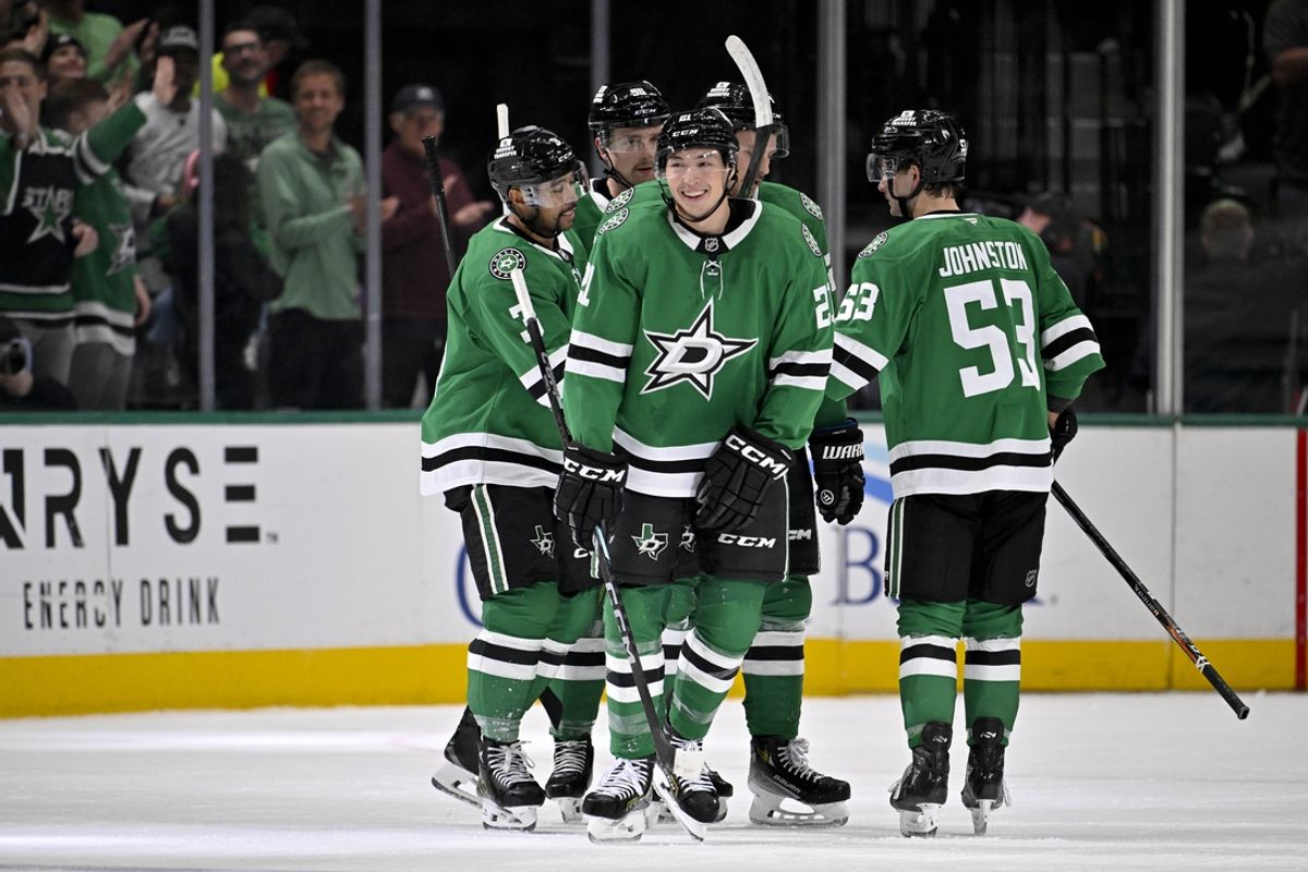 Nov 20, 2024; Dallas, Texas, USA; Dallas Stars defenseman Mathew Dumba (3) and center Wyatt Johnston (53) and left wing Jason Robertson (21) celebrates a goal scored by Robertson against the San Jose Sharks during the first period at the American Airlines Center. Mandatory Credit: Jerome Miron-Imagn Images
