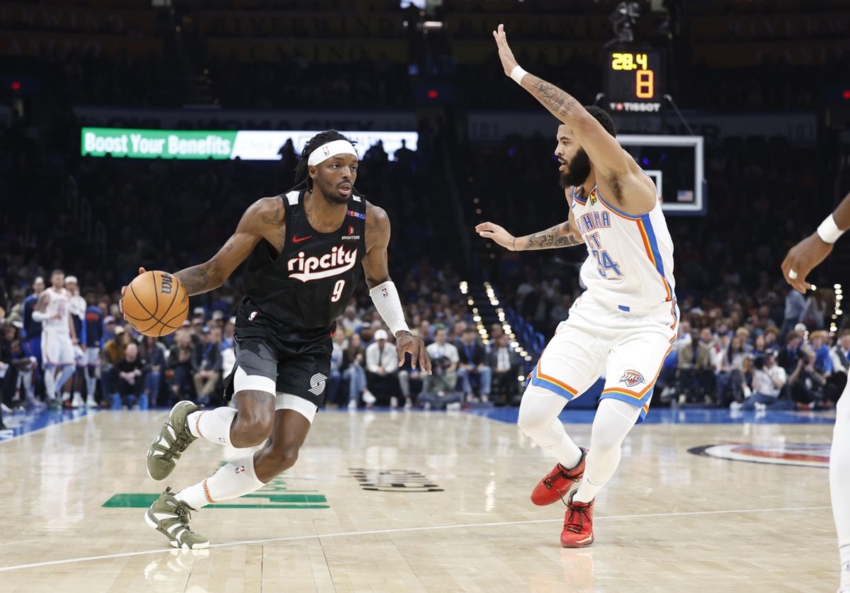 Nov 20, 2024; Oklahoma City, Oklahoma, USA; Portland Trail Blazers forward Jerami Grant (9) drives against Oklahoma City Thunder forward Kenrich Williams (34) during the second quarter at Paycom Center. Mandatory Credit: Alonzo Adams-Imagn Images