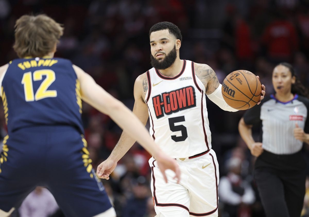 Nov 20, 2024; Houston, Texas, USA; Houston Rockets guard Fred VanVleet (5) brings the ball up the court as Indiana Pacers forward Johnny Furphy (12) defends during the first quarter at Toyota Center. Mandatory Credit: Troy Taormina-Imagn Images