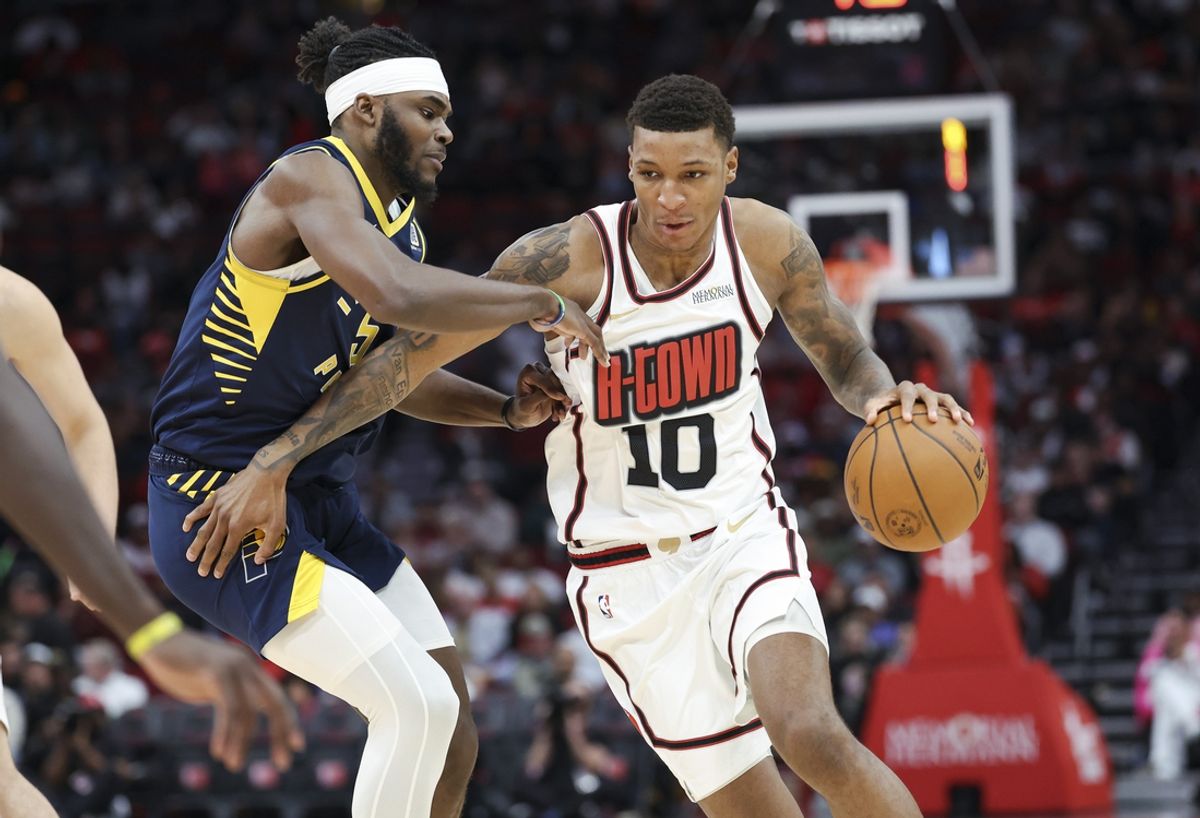 Nov 20, 2024; Houston, Texas, USA; Houston Rockets forward Jabari Smith Jr. (10) dribbles the ball Indiana Pacers forward Jarace Walker (5) defends during the second quarter at Toyota Center. Mandatory Credit: Troy Taormina-Imagn Images