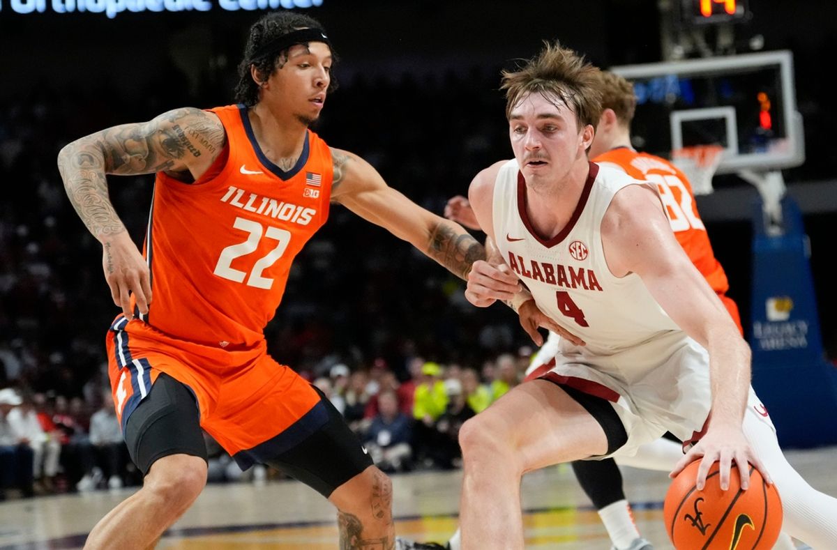 Nov 20, 2024; Birmingham, AL, USA; Illinois guard Trey White (22) defends as Alabama forward Grant Nelson (4) drives with the ball in the CM Newton Classic at Legacy Arena. Mandatory Credit: Gary Cosby Jr.-Tuscaloosa News