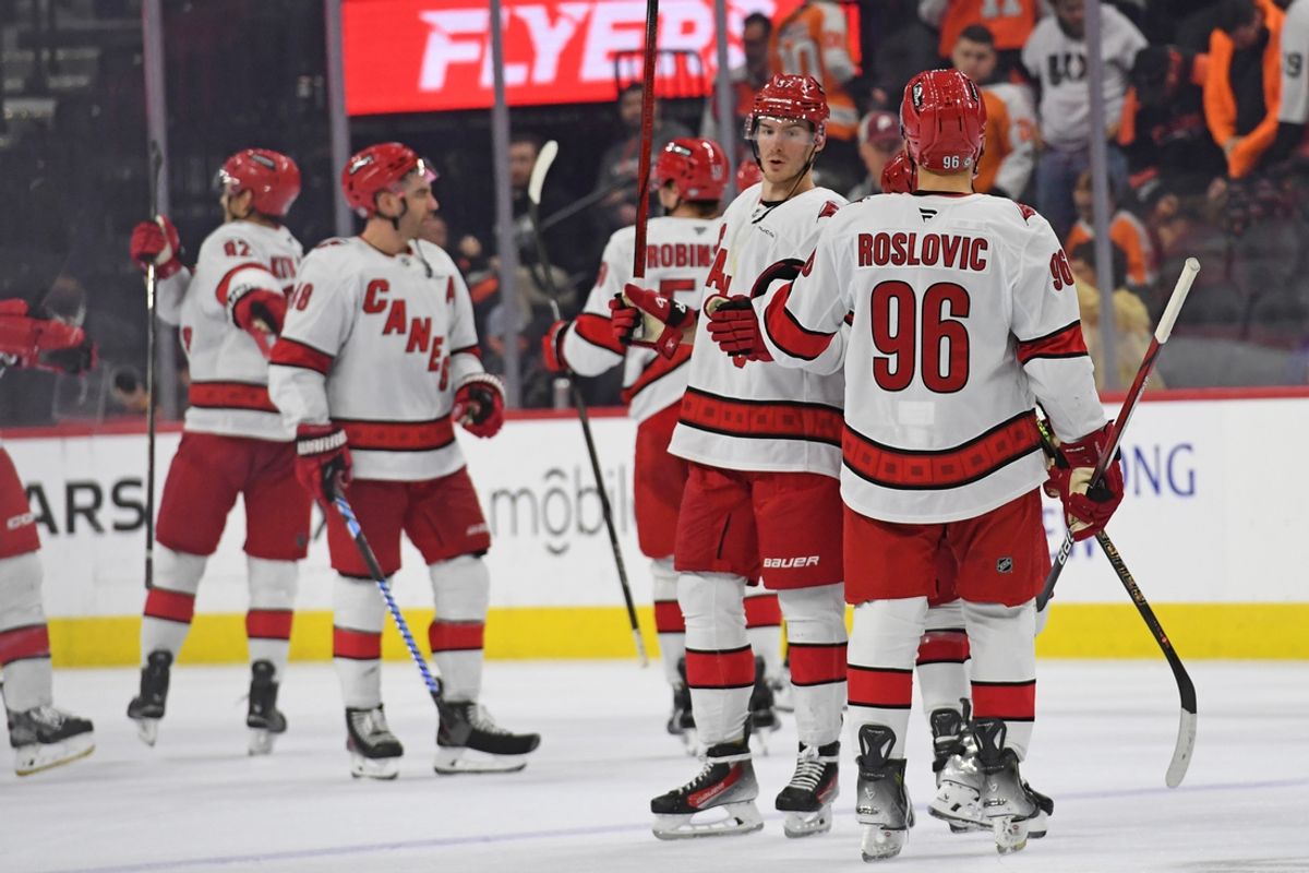 Nov 20, 2024; Philadelphia, Pennsylvania, USA; Carolina Hurricanes right wing Andrei Svechnikov (37) and center Jack Roslovic (96) celebrate win against the Philadelphia Flyers during the third period at Wells Fargo Center. Mandatory Credit: Eric Hartline-Imagn Images