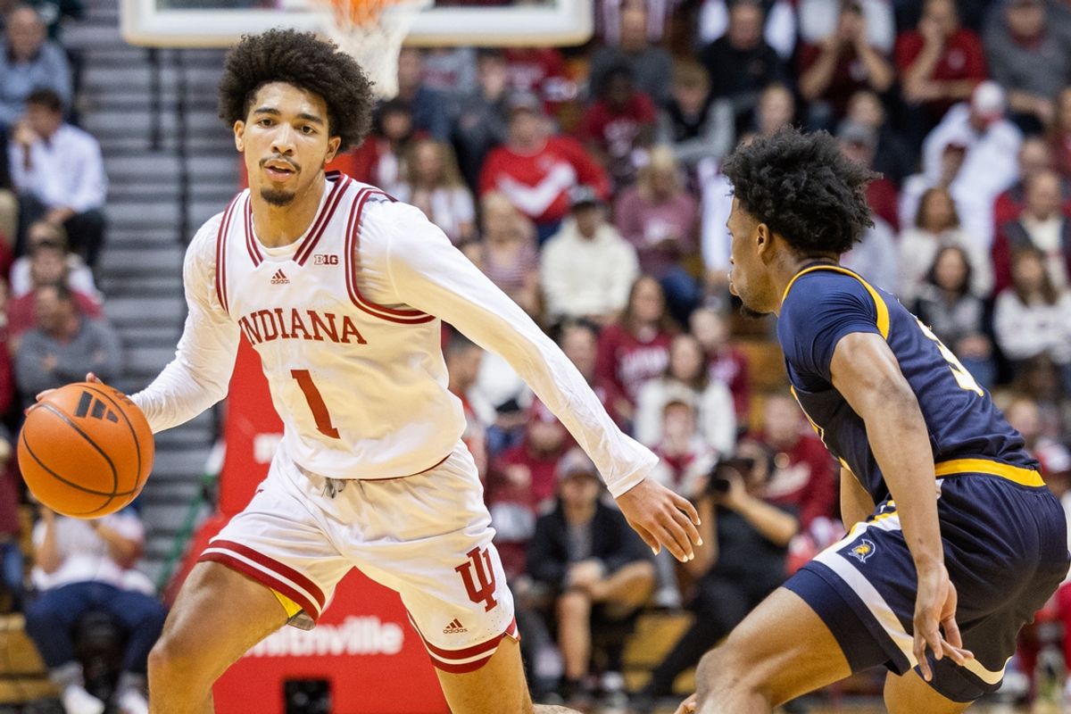 Nov 21, 2024; Bloomington, Indiana, USA; Indiana Hoosiers guard Myles Rice (1) dribbles the ball while UNC-Greensboro Spartans guard Kenyon Giles (3) defends in the first half at Simon Skjodt Assembly Hall. Mandatory Credit: Trevor Ruszkowski-Imagn Images