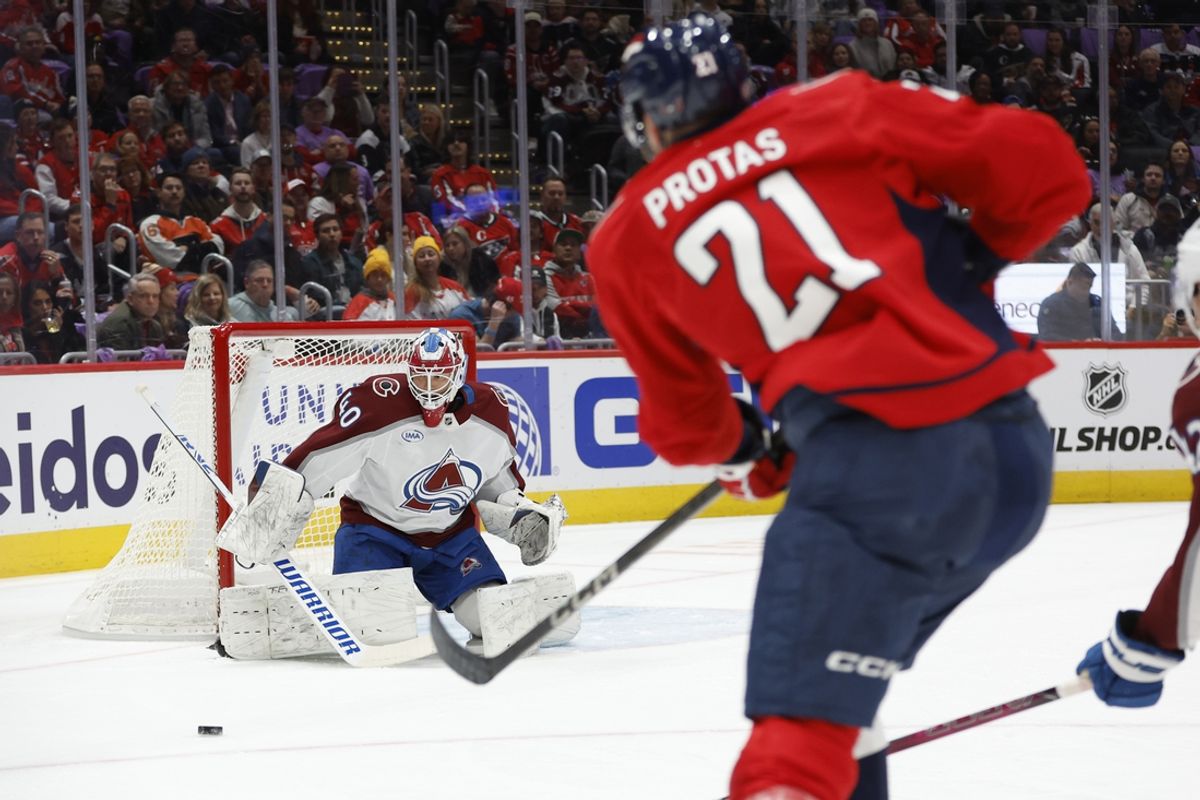 Nov 21, 2024; Washington, District of Columbia, USA; Colorado Avalanche goaltender Alexandar Georgiev (40) mas/ on Washington Capitals center Aliaksei Protas (21) in the first period at Capital One Arena. Mandatory Credit: Geoff Burke-Imagn Images