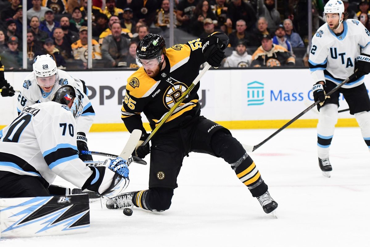 Nov 21, 2024; Boston, Massachusetts, USA;  Boston Bruins right wing Justin Brazeau (55) looks for a rebound in front of Utah Hockey Club goaltender Karel Vejmelka (70) during the first period at TD Garden. Mandatory Credit: Bob DeChiara-Imagn Images
