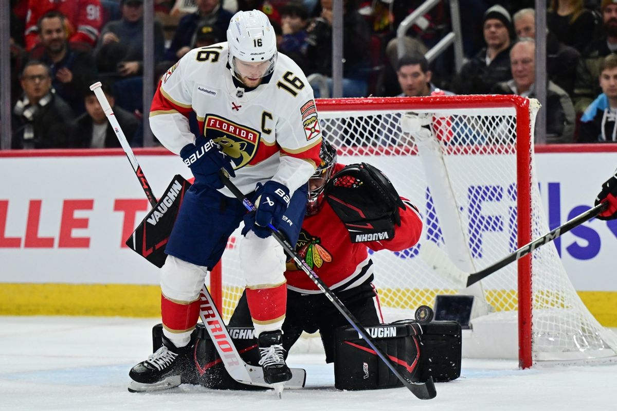 Nov 21, 2024; Chicago, Illinois, USA; Florida Panthers center Aleksander Barkov (16) plays the puck as Chicago Blackhawks goaltender Petr Mrazek (34) defends his goal during the first period at the United Center. Mandatory Credit: Daniel Bartel-Imagn Images