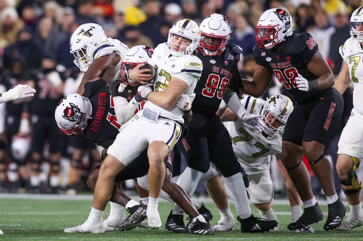 Nov 21, 2024; Atlanta, Georgia, USA; Georgia Tech Yellow Jackets quarterback Aaron Philo (12) runs the ball against the North Carolina State Wolfpack in the second quarter at Bobby Dodd Stadium at Hyundai Field. Mandatory Credit: Brett Davis-Imagn Images