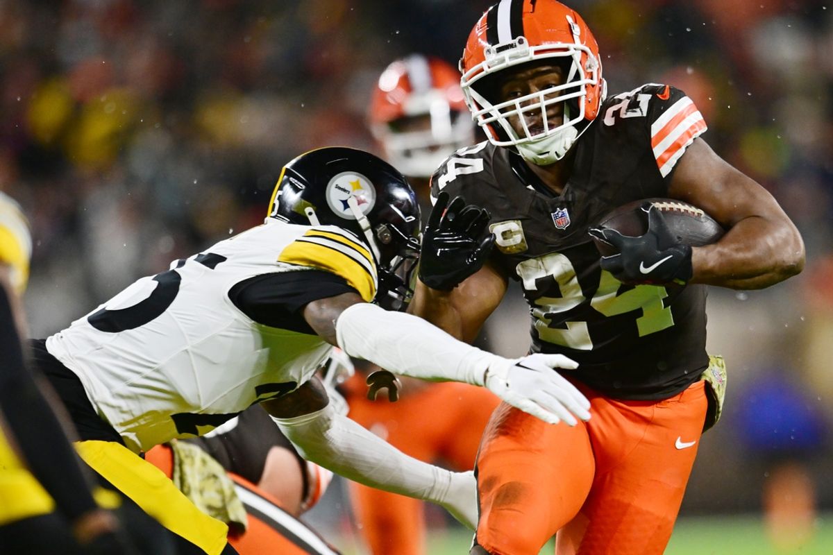Nov 21, 2024; Cleveland, Ohio, USA; Cleveland Browns running back Nick Chubb (24) runs with the ball against Pittsburgh Steelers safety DeShon Elliott (25) during the first half at Huntington Bank Field. Mandatory Credit: Ken Blaze-Imagn Images