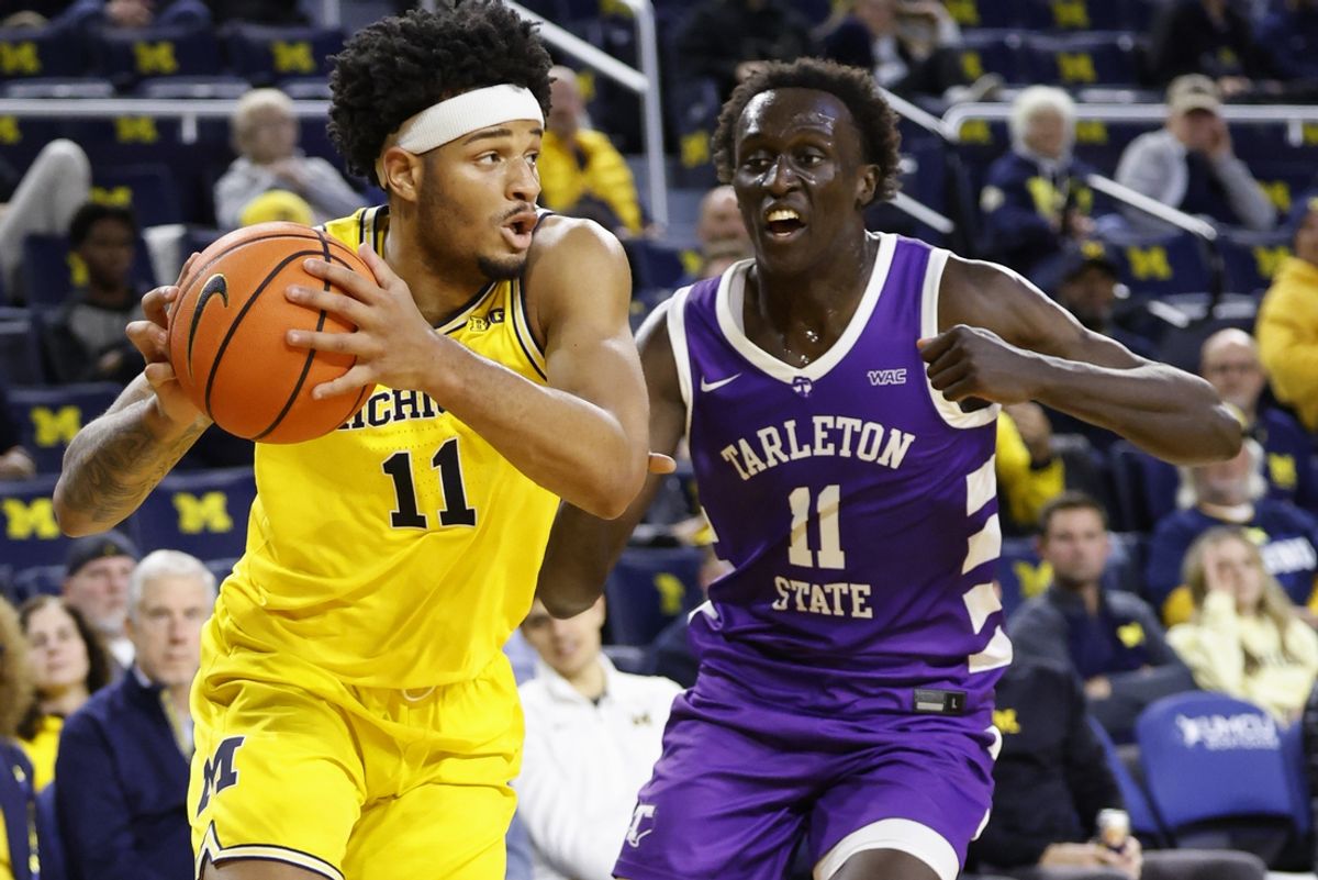 Nov 21, 2024; Ann Arbor, Michigan, USA;  Michigan Wolverines guard Roddy Gayle Jr. (11) dribbles defended by Tarleton Texans guard Bubu Benjamin (11) in the first half at Crisler Center. Mandatory Credit: Rick Osentoski-Imagn Images