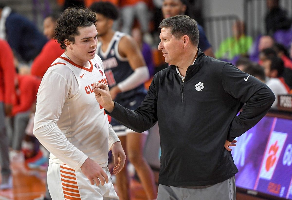 Clemson senior forward Ian Schieffelin (4) listens to Clemson Head Coach Brad Brownell during the second half at Littlejohn Coliseum Thursday, November 21, 2024; Clemson, SC, USA.